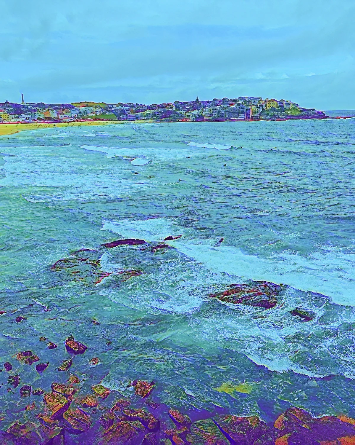 Painted-effect rocky coastline and blue sea