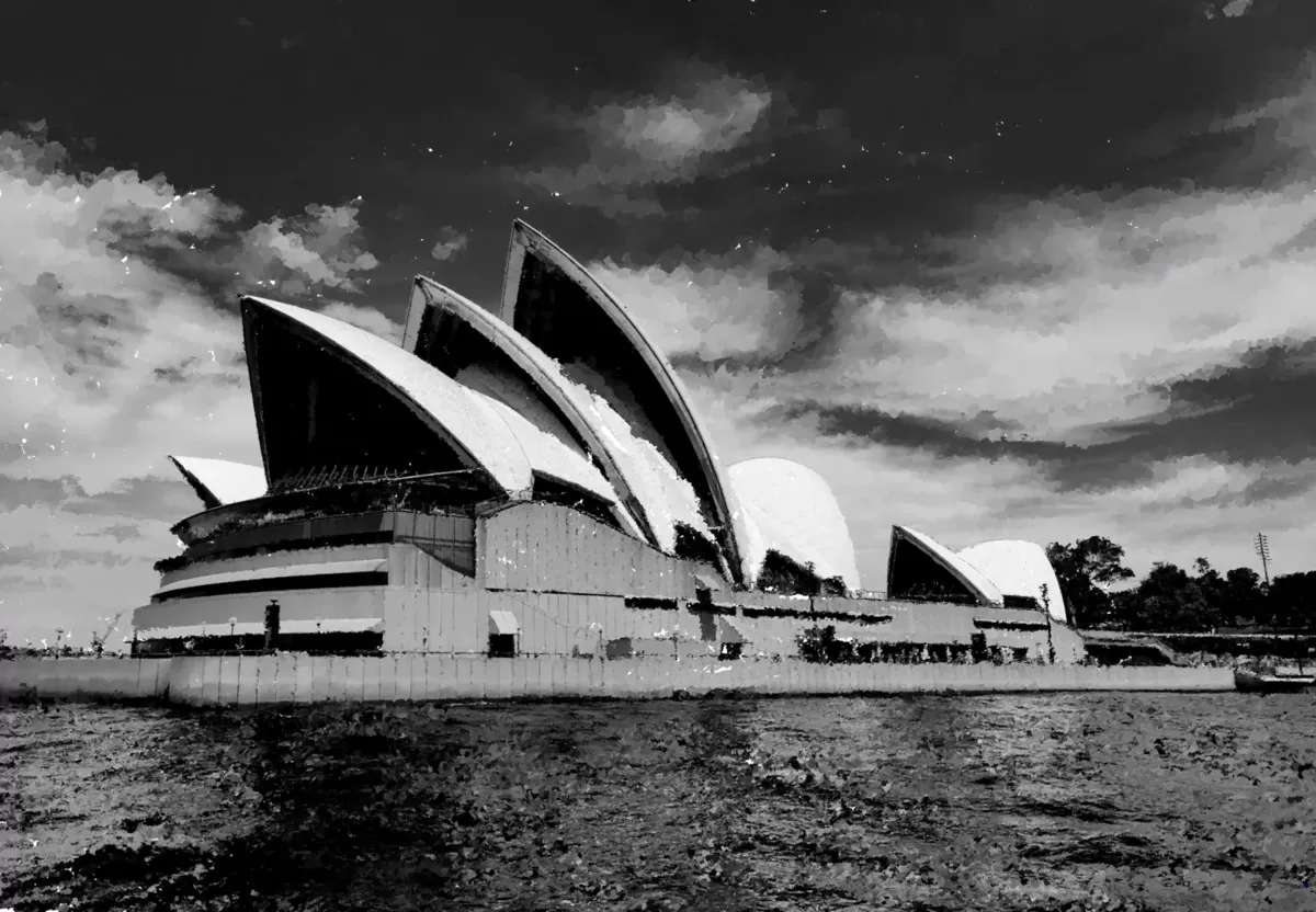 Black and white Sydney Opera House under dramatic clouds